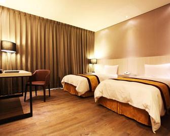 Sankaikan Hotel - Puzi City - Habitación
