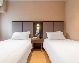 Pujiang Star Inn Shanghai Xujiahui Branch - Shanghai - Camera da letto