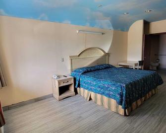 Woodland Inn & Suites - Rosenberg - Habitación